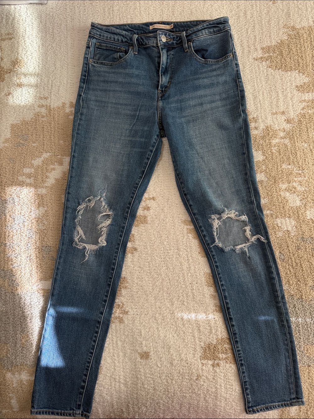 Levi’s Strauss High-Rise Distressed Skinny Jeans in Dark Blue